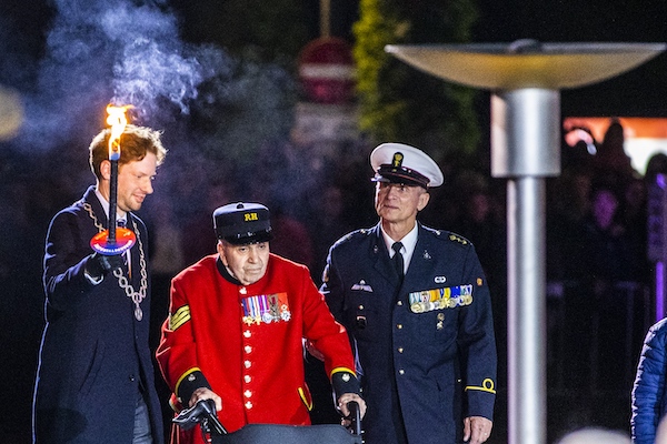 British veteran, 96, lights flame to start Liberation Day celebrations